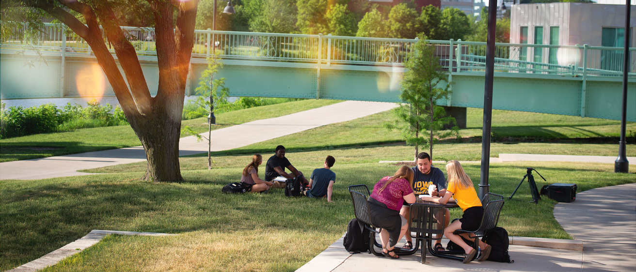 Students studying outdoors at Iowa Memorial Union