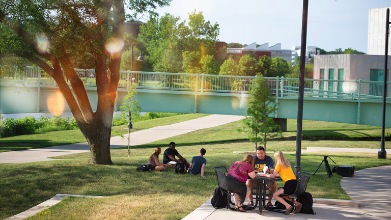 Students studying outdoors at Iowa Memorial Union