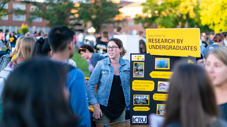 student outside at organization fair